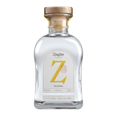 Eine elegante Flasche mit klarer Flüssigkeit, die ein gelbes 'Z' und die Aufschrift 'Mirabelle' trägt.