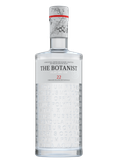 Eine elegante Flasche mit dem Etikett 'The Botanist Islay Dry Gin', verziert mit botanischen Namen auf der Oberfläche.