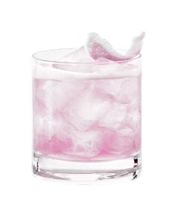 Ein Glas mit einem leuchtend grünen Cocktail, gefüllt mit Eis und dekoriert mit einer Limettenschale auf der Oberseite.