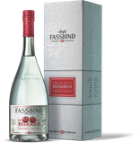 Die Flasche Rigi-Kirsch zeigt ein modernes Design, während die Verpackung mit floralen Mustern die Handwerkskunst betont.