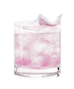 Ein Glas mit einem leuchtend grünen Cocktail, gefüllt mit Eis und dekoriert mit einer Limettenschale auf der Oberseite.